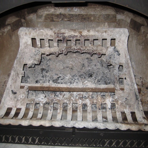 warped and melted fire grate